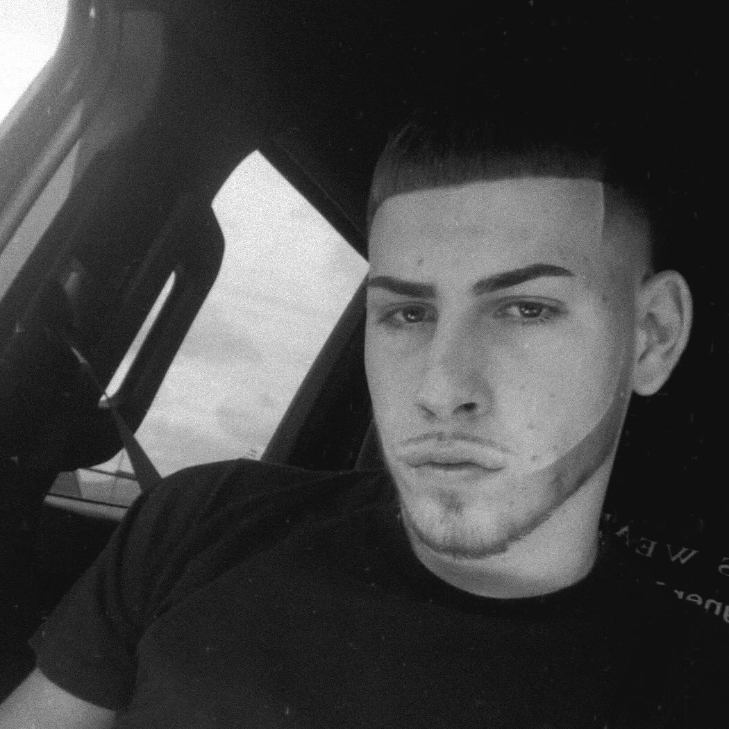 GJ — owner and barber